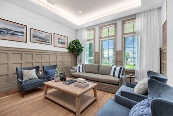 a living room with couches and chairs and a coffee table at The Enclave at Deer Moss Creek, Niceville, FL